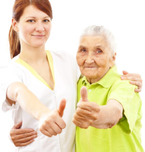 doctor and patient showing thumbs up